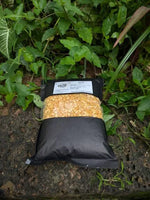 Buta Dali 1kg pack containing premium roasted gram dal with a crunchy texture and rich flavor