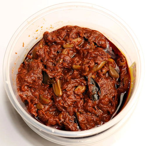 Rasuna Achar 250gm made with premium garlic cloves and traditional spices, offering a rich tangy and spicy flavor for Indian meals
